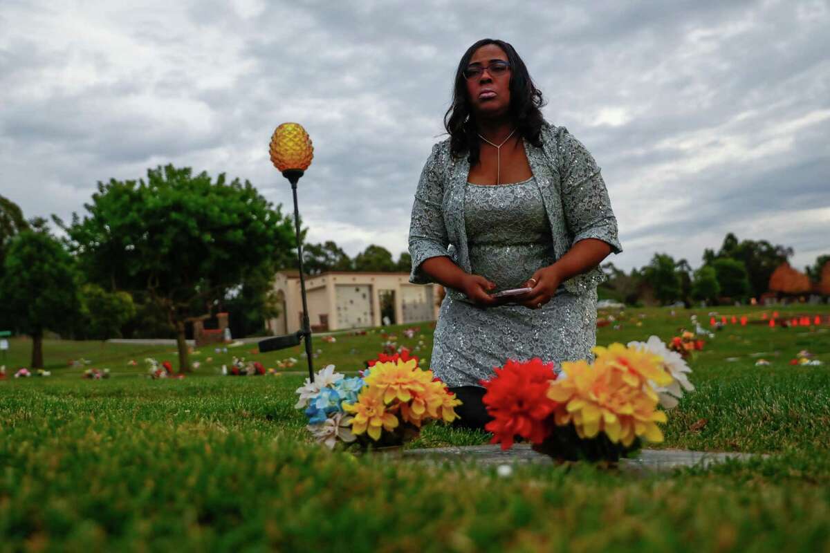 Wanda Johnson, the mother of Oscar Grant, spends time at Oscar's gravsitee during a visit at the Lone Tree Cemetary in Hayward on Saturday, December 15, 2018.
