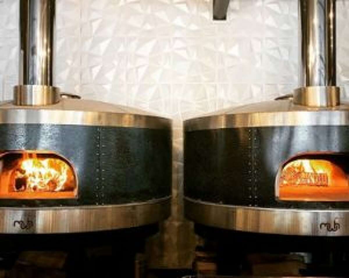 Flatbread Social, a casual-dining spot focusing on pizza and flatbread made in wood-fired ovens, opens Dec. 31 at 84 Henry St., Saratoga Springs. Owners Ryan and Sonja McFadden also own Henry Street Taproom, next door at 86 Henry St. (Photo via Instagram.)