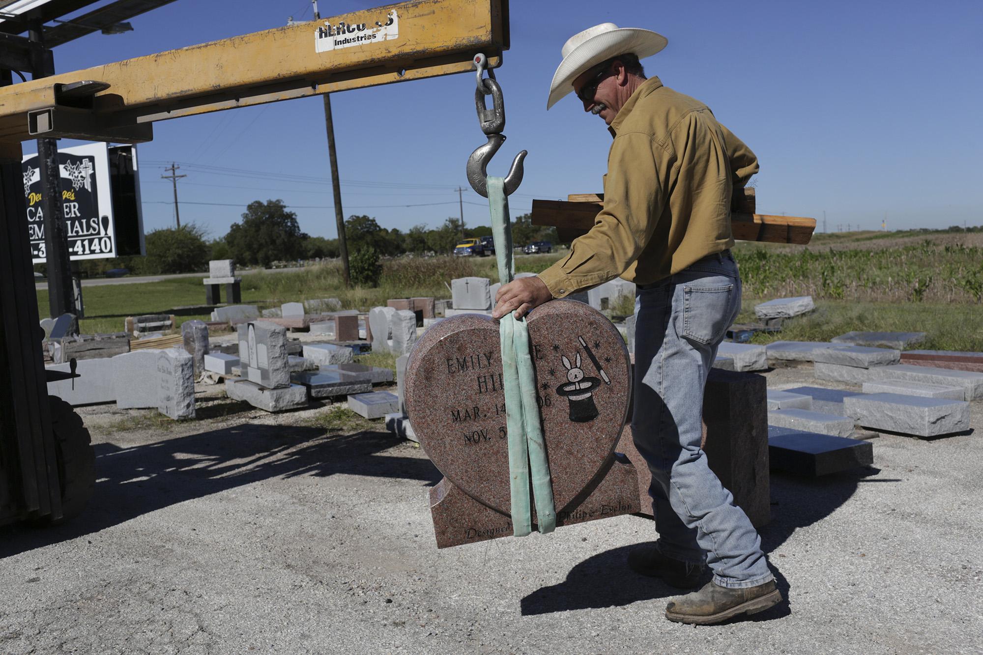 Rich Luna from Laredo, Texas, puts on foam hat before the start of