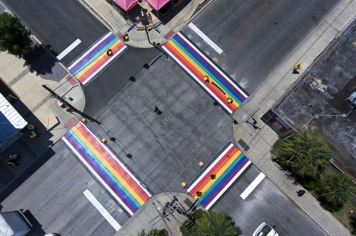 A city employee makes walks Wednesday, June 27, 2018 through the middle of the Main and Evergreen intersection near San Antonio College after the city of San Antonio finished a rainbow-themed set of crosswalks at the intersection