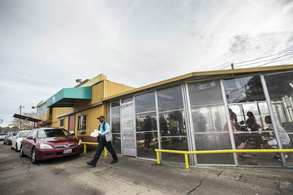 Customers line up to make their order at the original Frenchy's restaurant location on Monday, Dec. 31, 2018, in Houston. The original location, which opened in 1969, will serve its last meal there on January 1, before moving to a temporary location on the 4th of January.