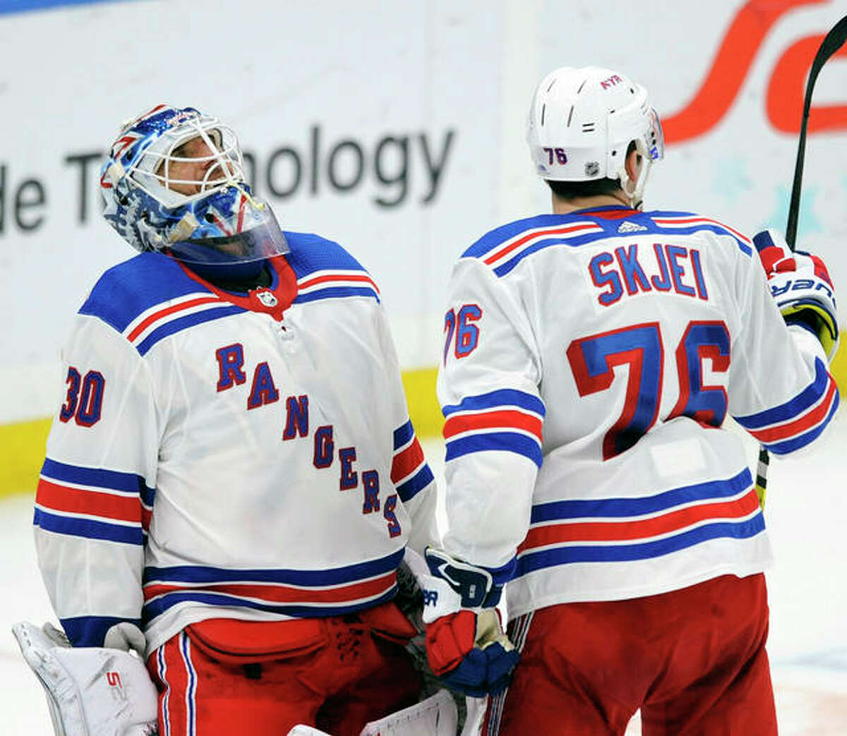 New York Rangers goalie Henrik Lundqvist (30), of Sweden, celebrates with Brady Skjei (76) after their 2-1 victory over the Blues Monday night in St. Louis.