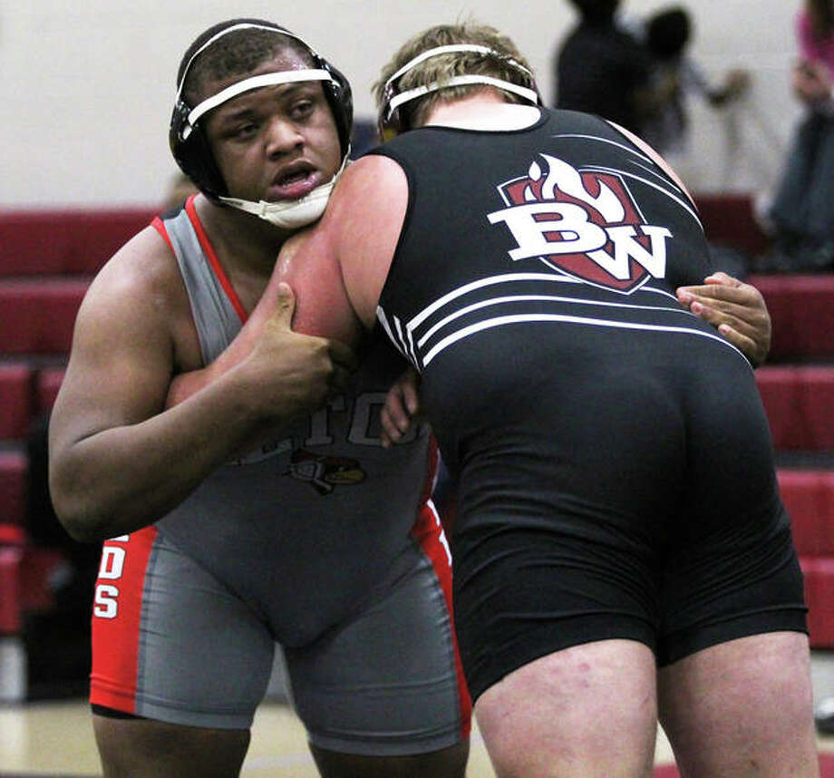 Alton’s Kyle Hughes (left), shown wrestling Belleville West’s Dustin Olmstead in a dual Dec. 20 at Granite City, pushed his record to 19-2 with a runner-up finish at 285 pounds Saturday at the Red Schmitt Invite at Granite City. Photo: Greg Shashack / The Telegraph