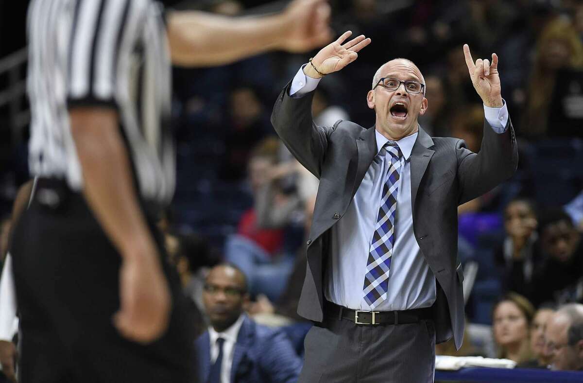 UConn coach Dan Hurley gestures to his team during the first half against Manhattan on Dec. 15.