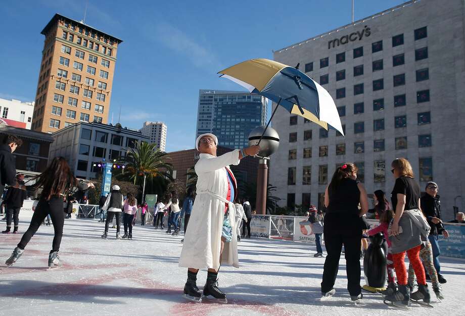 Larry Pascua skates with his umbrella and bathrobe during the New Year’s Day polar bear skate and costume contest at the Union Square ice skating rink in San Francisco on New Year’s Day 2019. Photo: Paul Chinn / The Chronicle