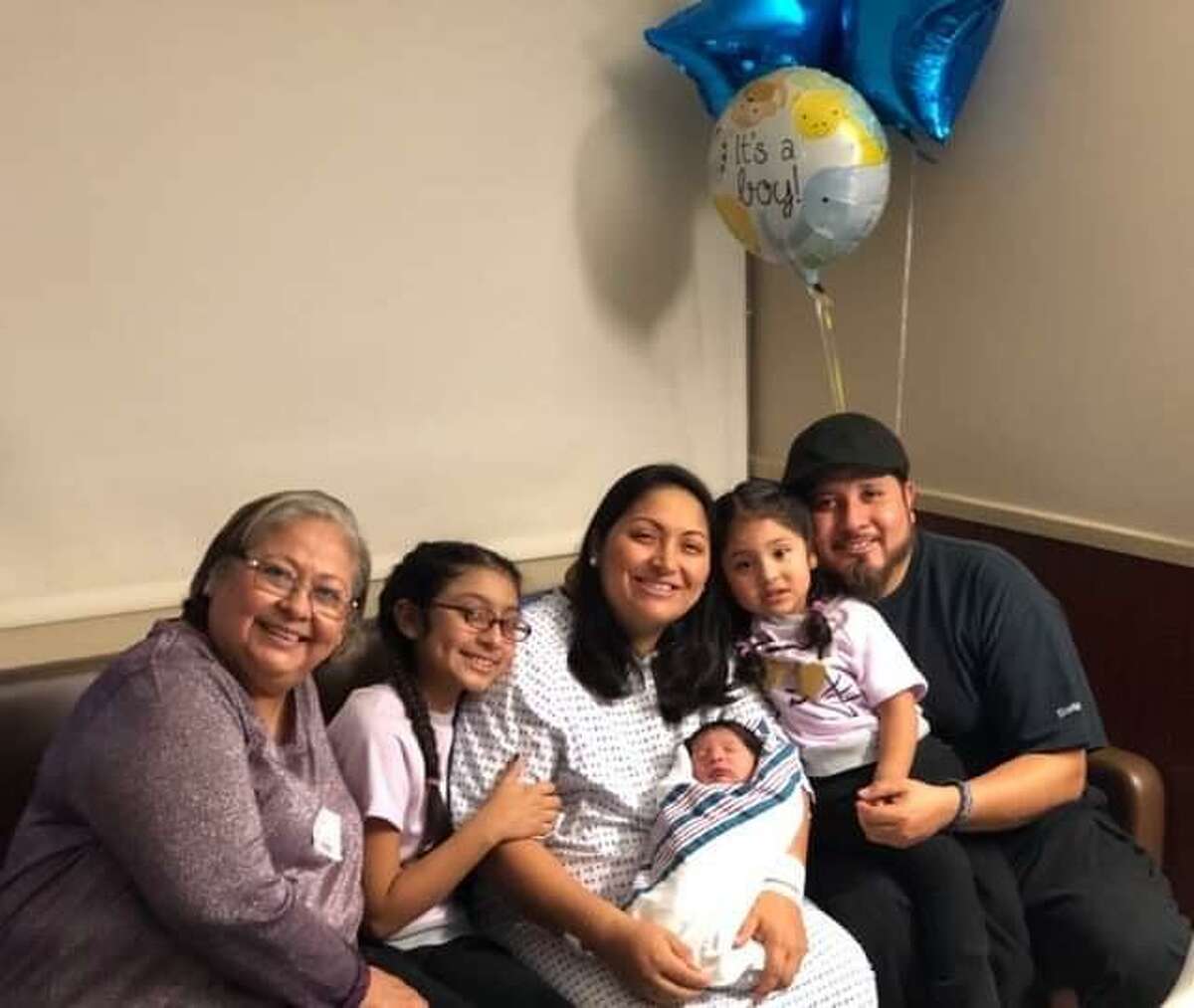 The Ramirez family welcomed newborn son Richard Eugene just 22 seconds after midnight. Here Maria Ramirez holding the baby poses for a picture with her mother-in-law, Virginia Sanchez, her daughters Bridgette Nicole, 9 and Ellianne Marie, 2 and husband Gerardo