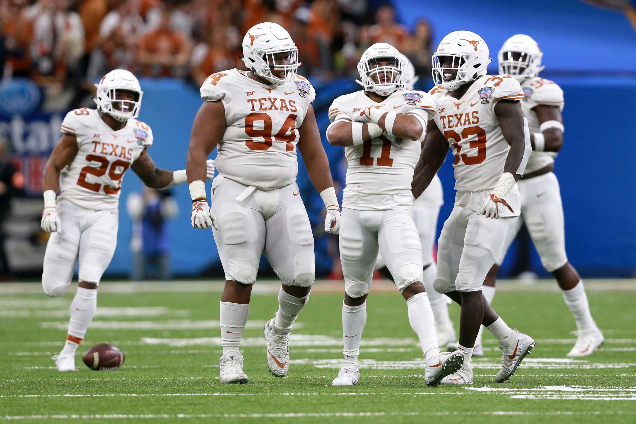 Ehlinger runs for 3 scores as Texas shocks Georgia in Sugar Bowl