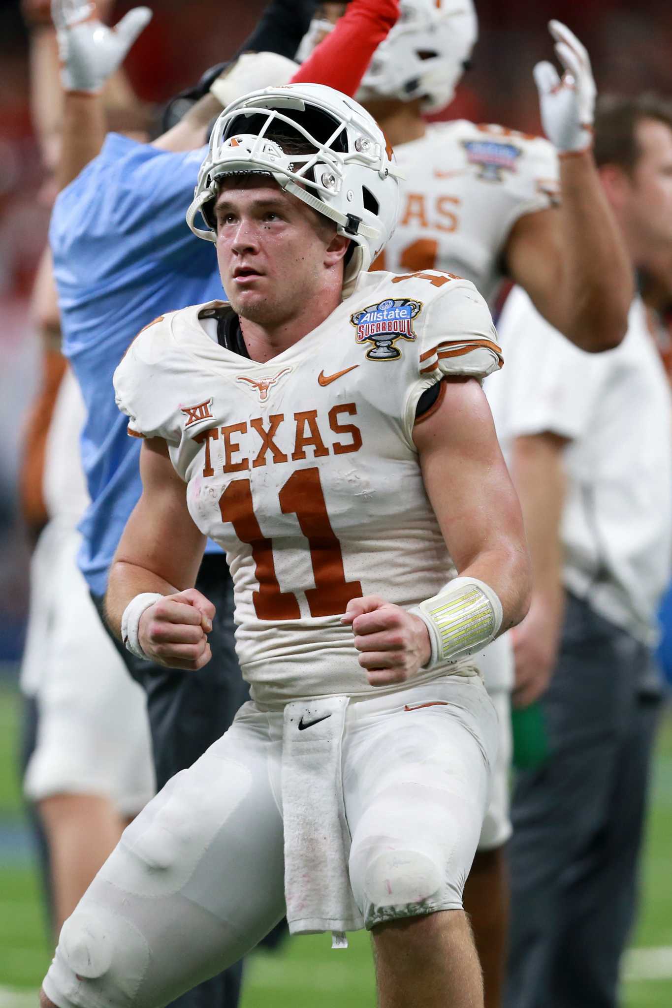 Ehlinger runs for 3 scores as Texas shocks Georgia in Sugar Bowl