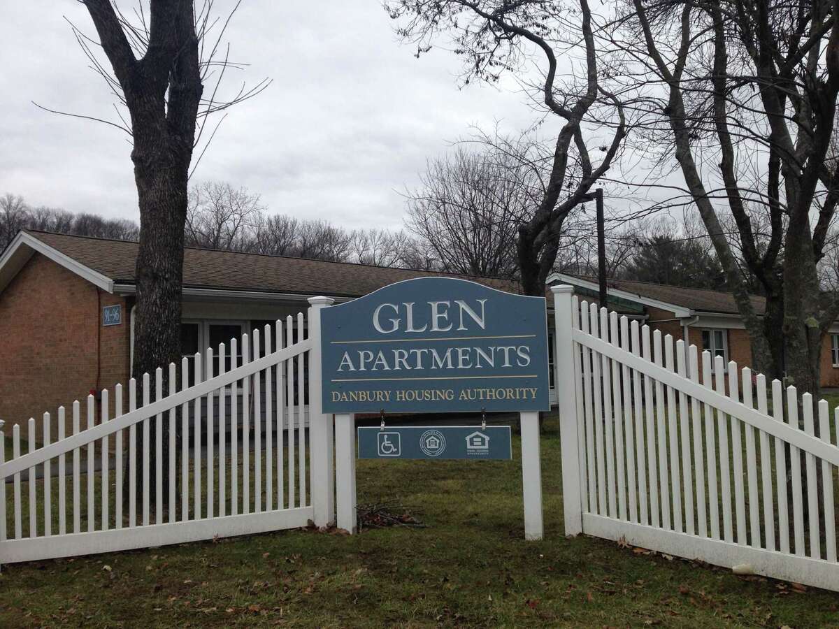 A man was killed and a woman injured by a Danbury officer at the Glen Apartments on Saturday night.