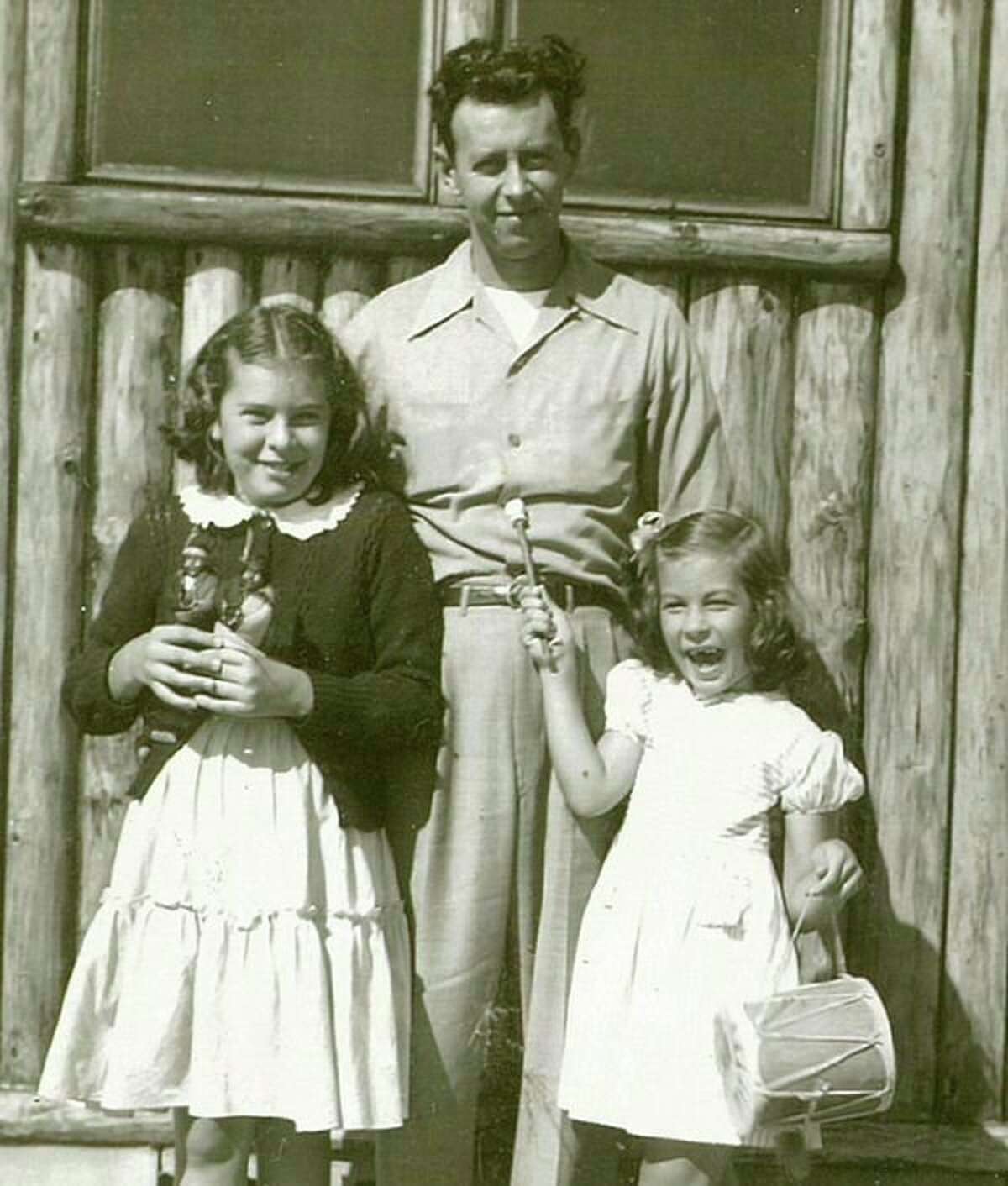 Ed Flore is with his two daughters, Bev on the left and Sally on the right. Ed and his brother Andrew had a produce business on Gordon Street where the H Hotel is now. Later Ed and Dorothy owned a motel in Clare. When they retired, they returned to Midland to enjoy their three grandsons, Jeffrey, Brian and Craig. 'Joyous is the word I come up with when I speak about my grandfather Ed Flore,' Craig said.