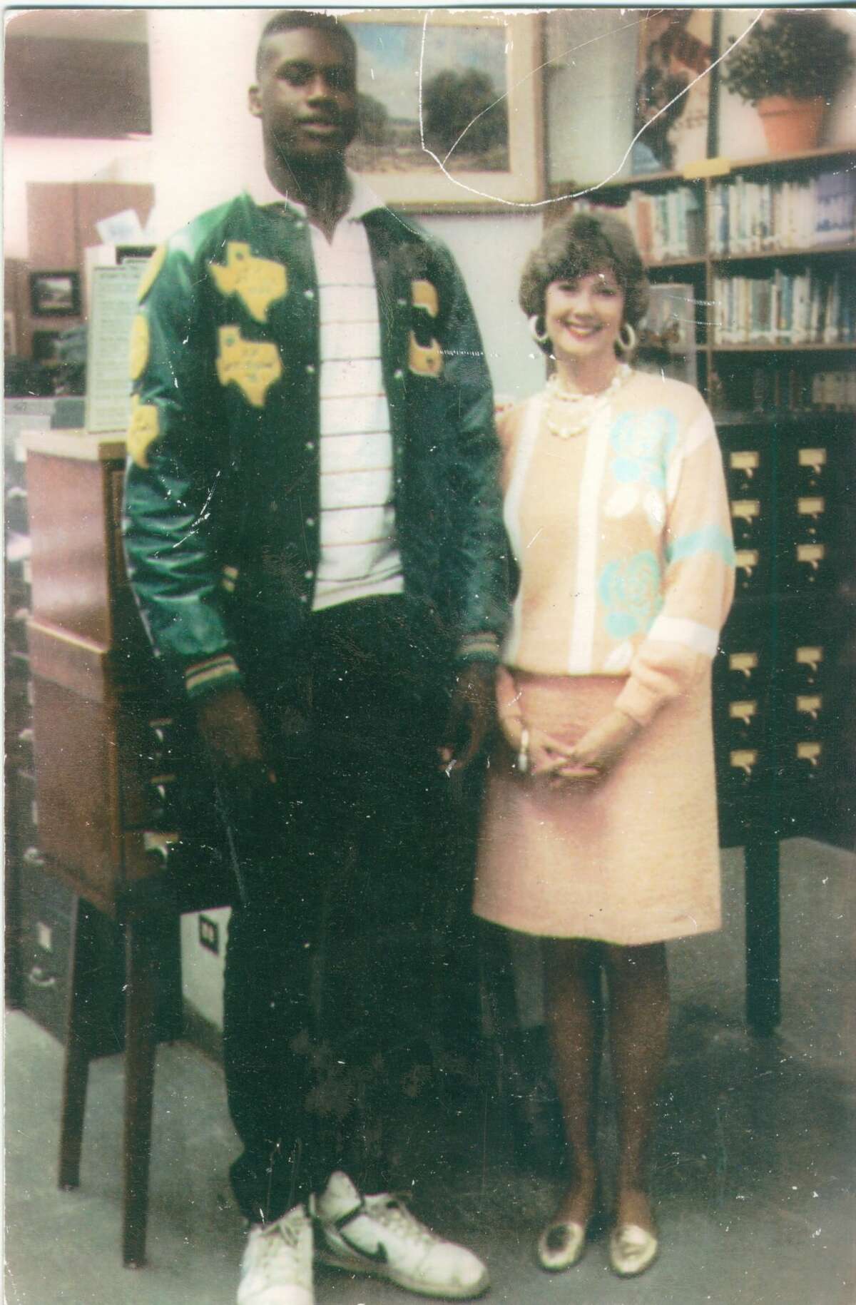 In 1989, shortly after the Cole High School boys basketball team posted a 36-0 record and won the 3A State Championship, Shaquille O'Neal posed with librarian Sandee Mewhinney. "I knew Shaquille would go far in his basketball career," she writes, "so I wanted a picture with him."