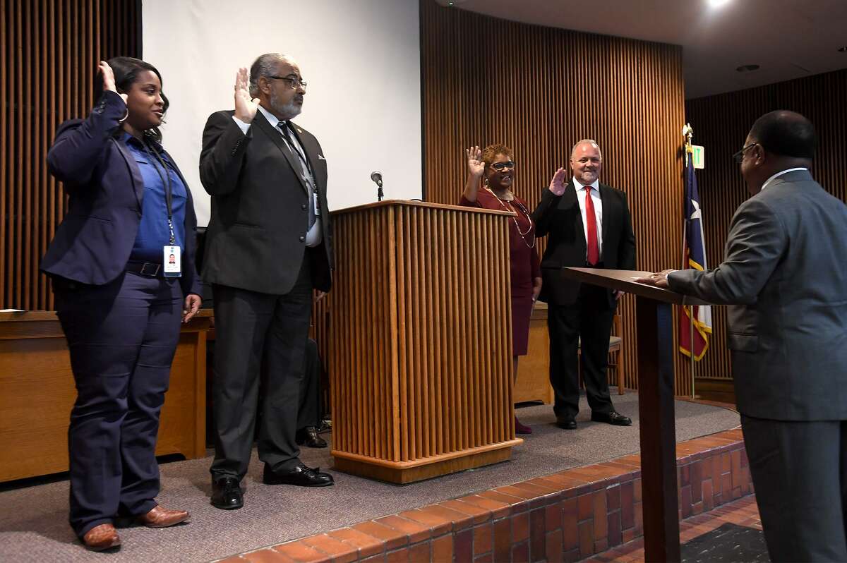 From left, Jevonne Pollard, Benjamin Collins, Carolyn Guidry and Charlie Hallmark are sworn in by former Judge Donald Floyd at the Jefferson County Courthouse on Wednesday. Pollard will serve as Precinct 1 Constable, Collins as Precinct 1, Place 2 Justice of the Peace, Guidry as County Clerk and Hallmark as Treasurer. Photo taken Wednesday, 1/2/19