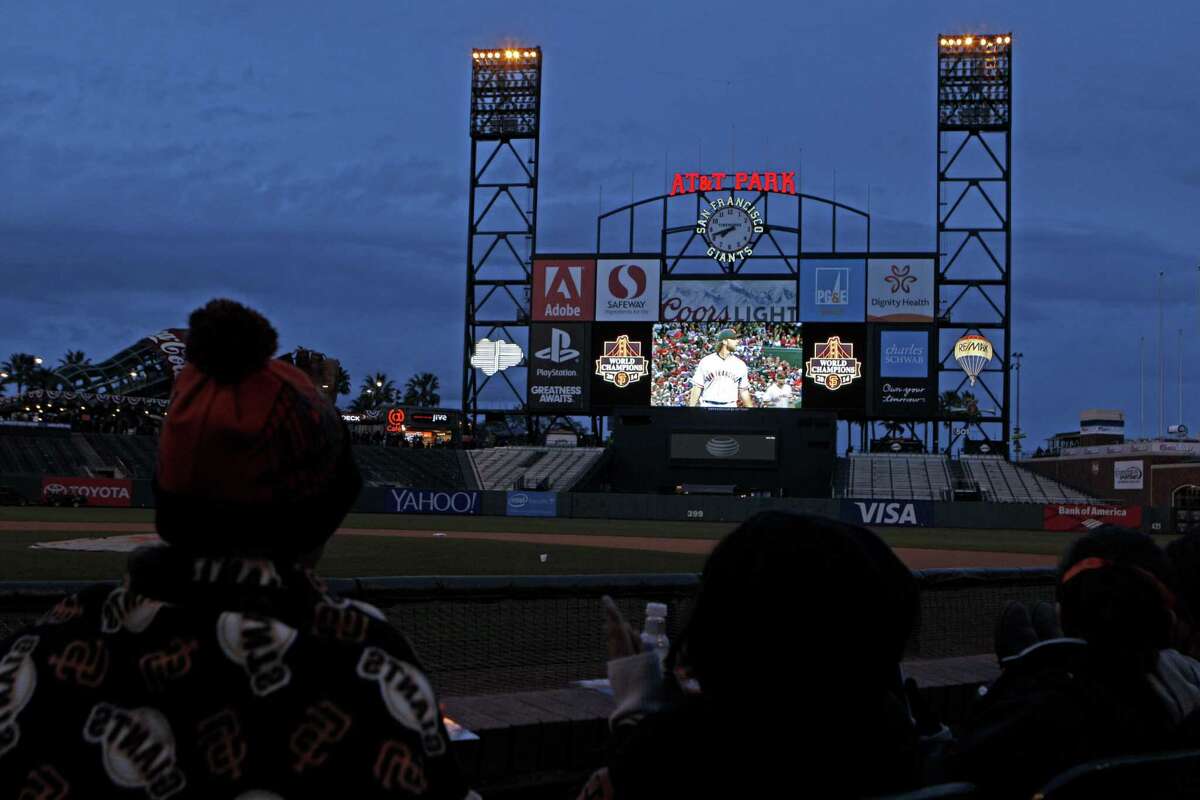 S.F. Giants fans watch the MLB baseball game between the San Francisco Giants and the Arizona Diamondbacks at AT&T Park's scoreboard, Monday, April 6, 2015. A view of the the old Mitsubishi Electric Diamond Vision scoreboard at the AT&T Park San Francisco, Calif. For the 2019 baseball season, In a $10 million project, the most the Giants have spent on a single capital improvement since the park opened in 2000, they are replacing their scoreboard with a larger, more technologically advanced board. It will cover 10,700 square feet, about 50 feet wider and 20 feet taller than its predecessor.