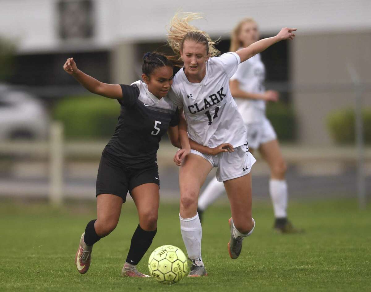 Steele's Feli Montoya (5) and Jessica Quinn (14) of Clark chase down the ball during UIL Class 6A bi-district girls high school soccer action at the Blossom Soccer Stadium West Field on Wednesday, March 28, 2018.