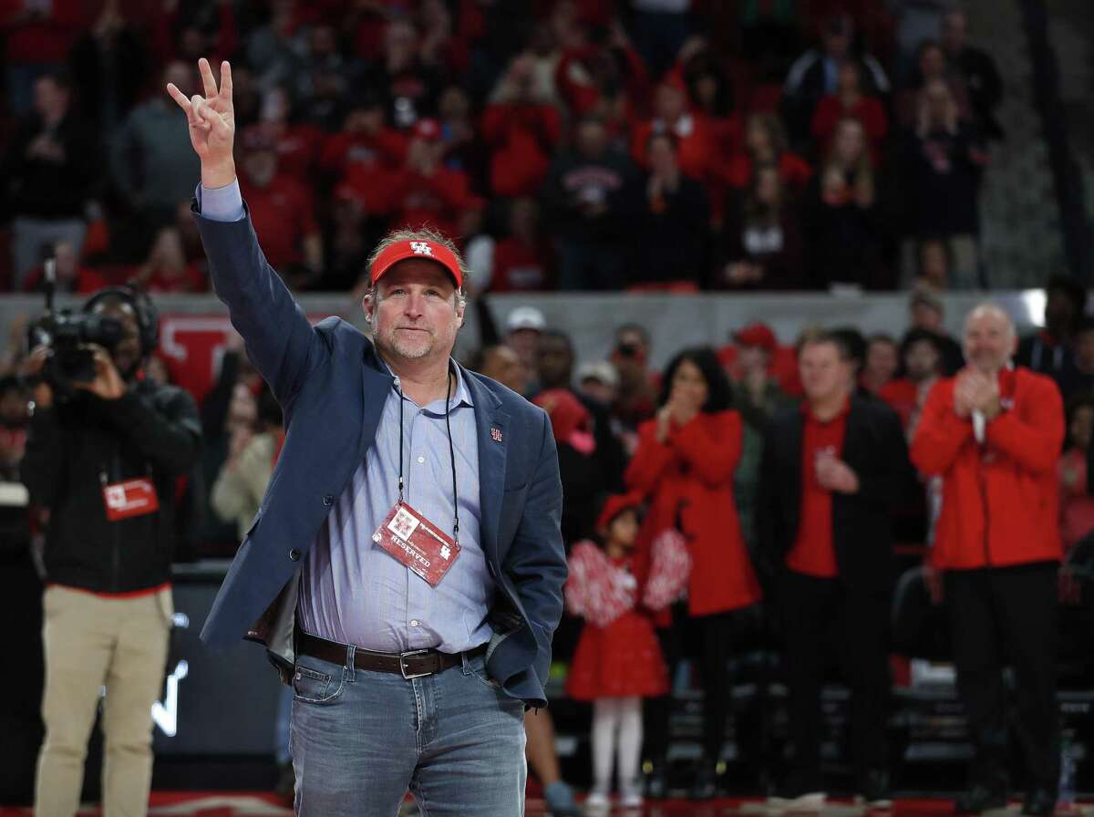PHOTOS: Everything you need to know about Dana Holgorsen  New Houston football coach Dana Holgorsen waves to the crowd during halftime of the Cougars’ basketball game against Tulsa at Fertitta Center on Wednesday night. >>>Here's the background on University of Houston's new football coach Dana Holgorsen ... 