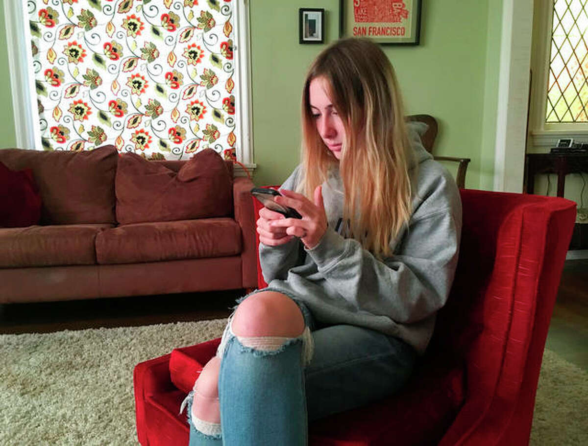 Laurel Foster is among teens involved in Stanford University research testing whether smartphones can be used to help detect depression and potential self-harm. Haven Daley | AP