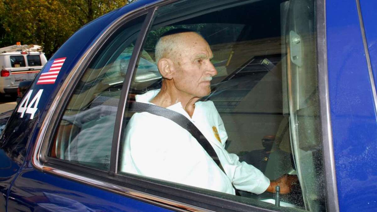 Gerardo Lombardi sits in a Greenwich patrol car in 2008.