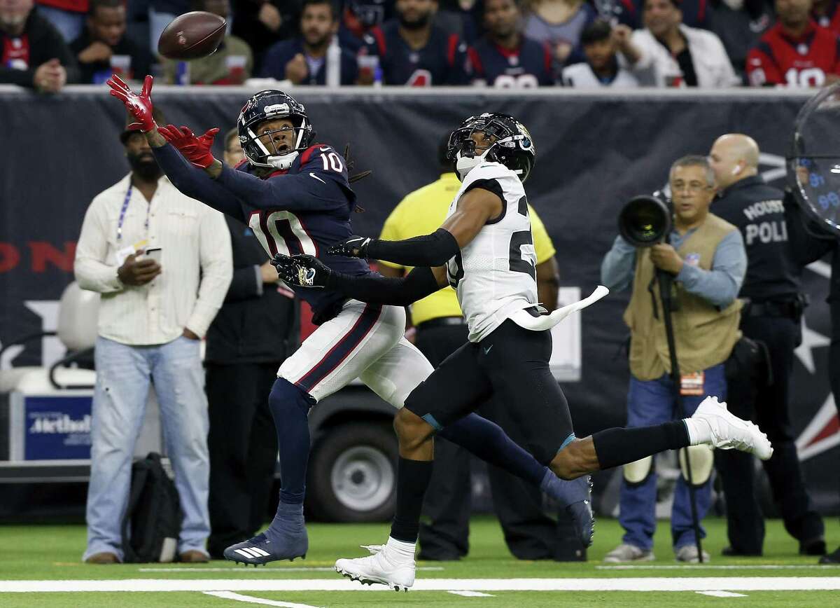 DeAndre Hopkins (10) of the Houston Texans makes a catch defended by Jalen Ramsey (20) of the Jacksonville Jaguars on December 30, 2018 in Houston.