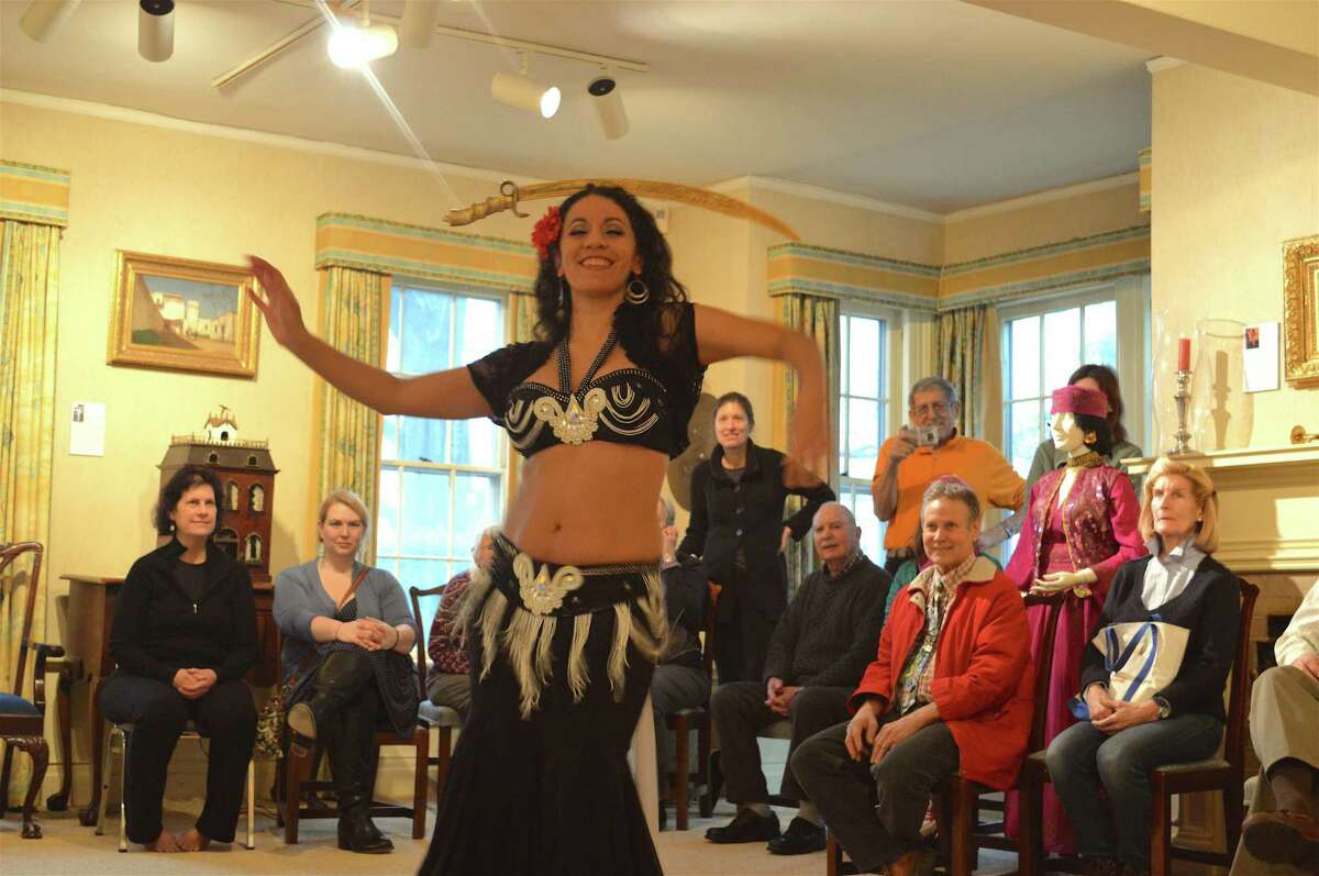 Tava Naiyin does a sword dance at the New Canaan Historical Society's "The Art of Belly Dancing with Tava" program on Sunday, Feb. 11, 2018, in New Canaan.