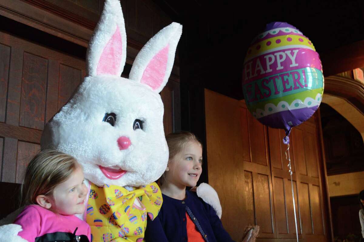 Emily Johnsen, 3, left, of New Canaan, and her sister, Abigail, 7, pose for a picture at the Recreation Department's "Breakfast with the Easter Bunny" event at Waveny House on March 17.