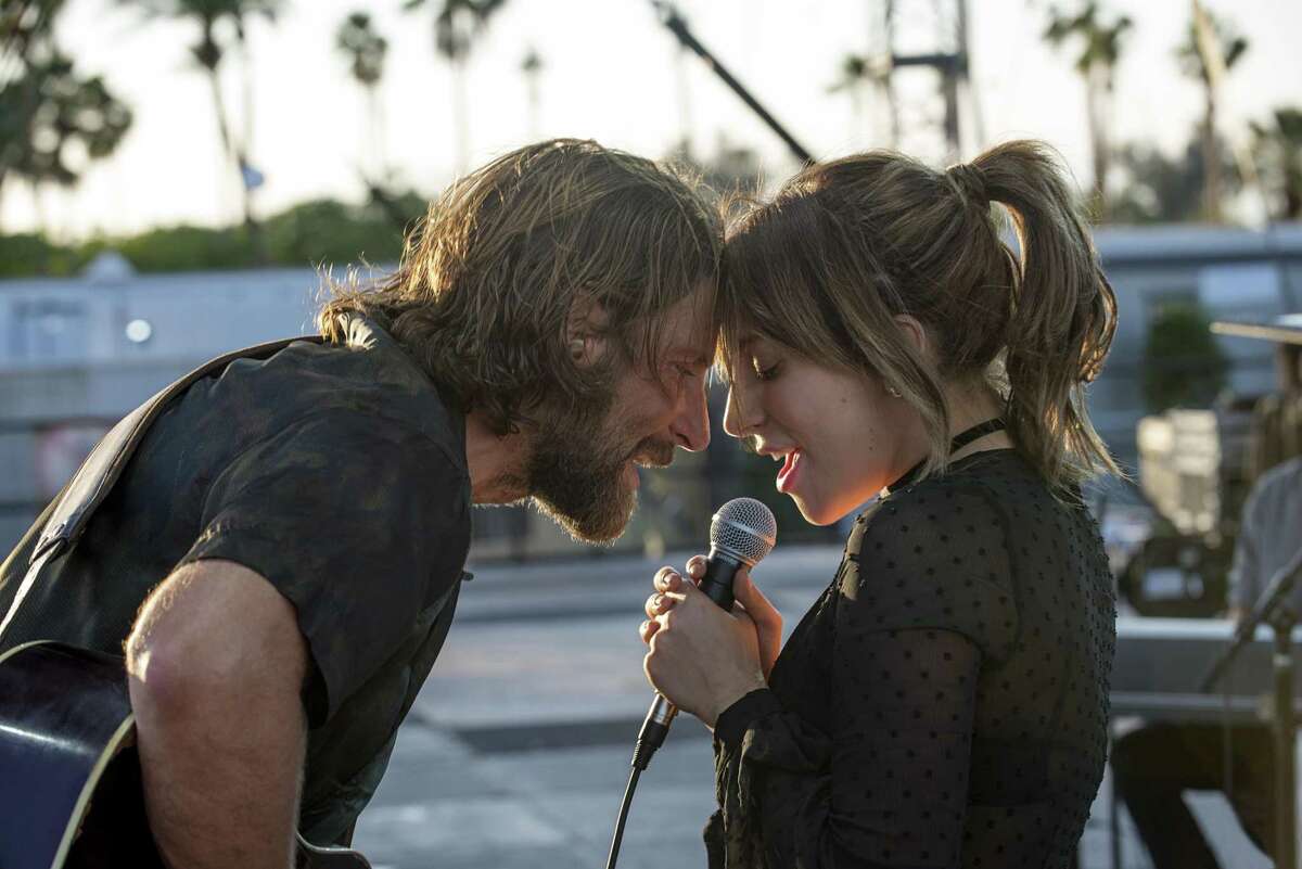 This image released by Warner Bros. shows Bradley Cooper, left, and Lady Gaga in a scene from the latest reboot of the film, “A Star is Born.” The film led nominations for the 25th Screen Actors Guild Awards with four nods including best ensemble on Wednesday, firmly establishing Bradley Cooper’s romantic revival as this year’s Academy Awards front runner. (Neal Preston/Warner Bros. via AP)