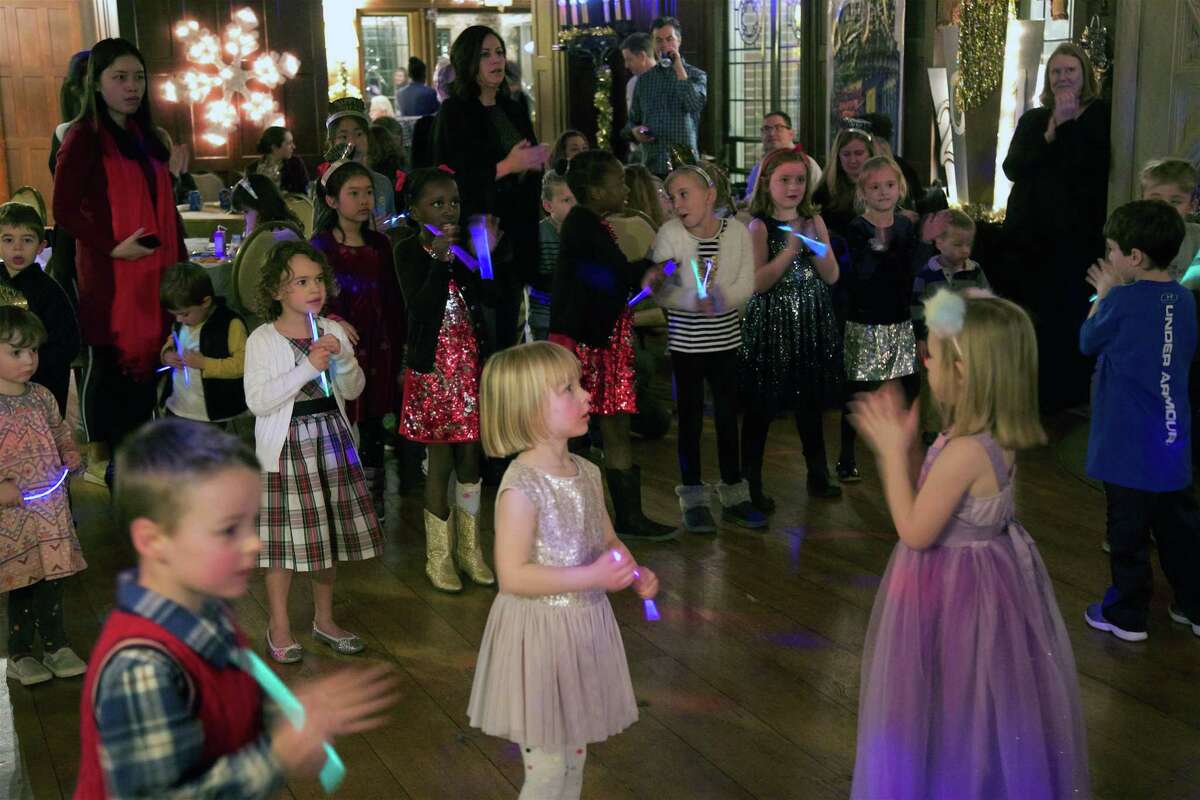 Kids enjoy the celebration at the New Year’s Eve Family Fun Night at Waveny House on Monday in New Canaan.