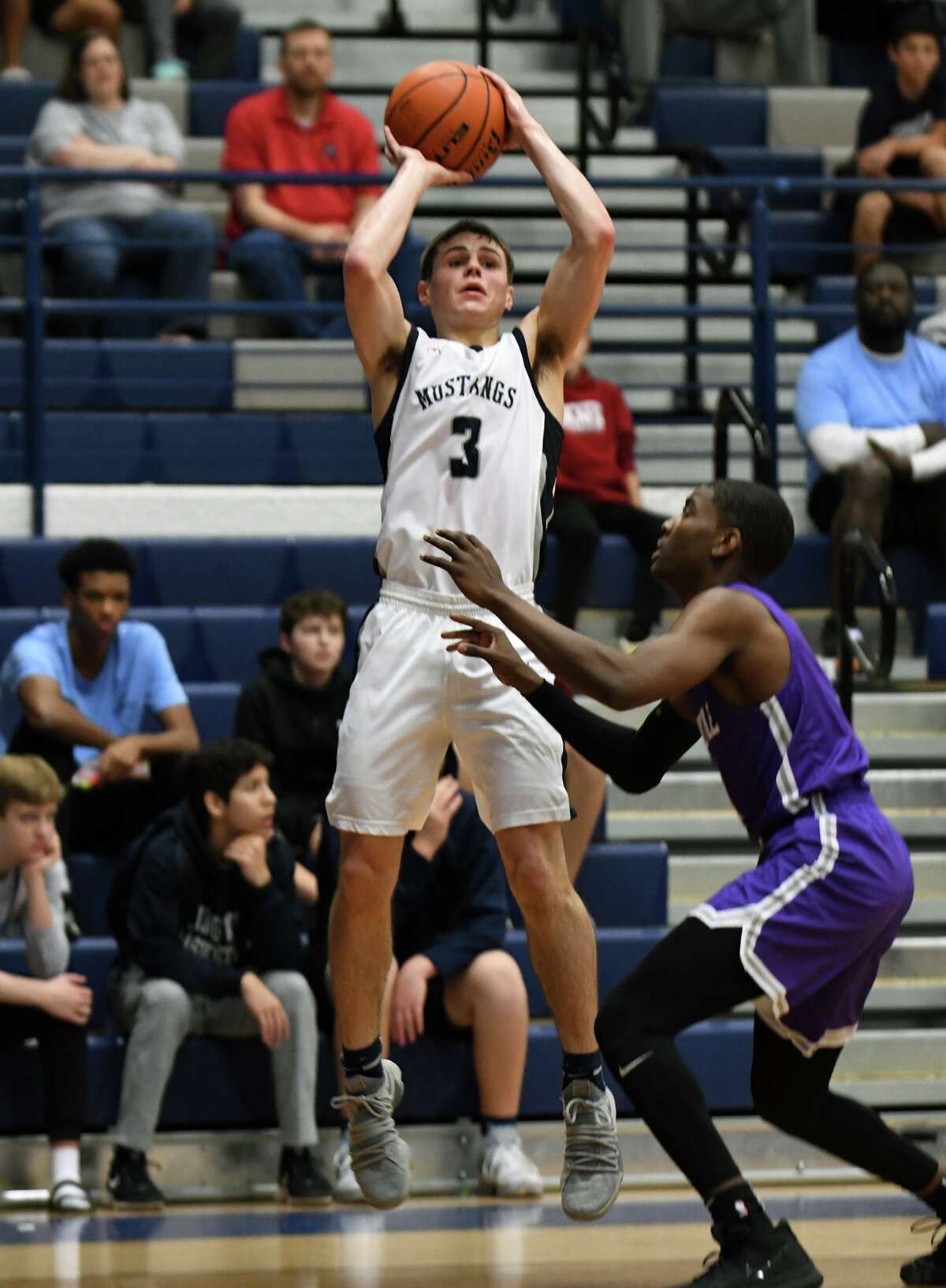 Kingwood sophomore Billy Gould (3) goes up for a three point shot over a Humble defender during the 2nd quarter of their District 22-6A matchup at KHS on Jan. 2, 2019.