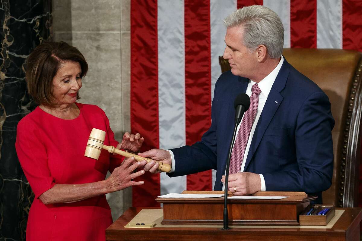 Nancy Pelosi of California takes the gavel from House Minority Leader Kevin McCarthy, R-Calif., after being elected House speaker at the Capitol in Washington, Thursday, Jan. 3, 2019. 