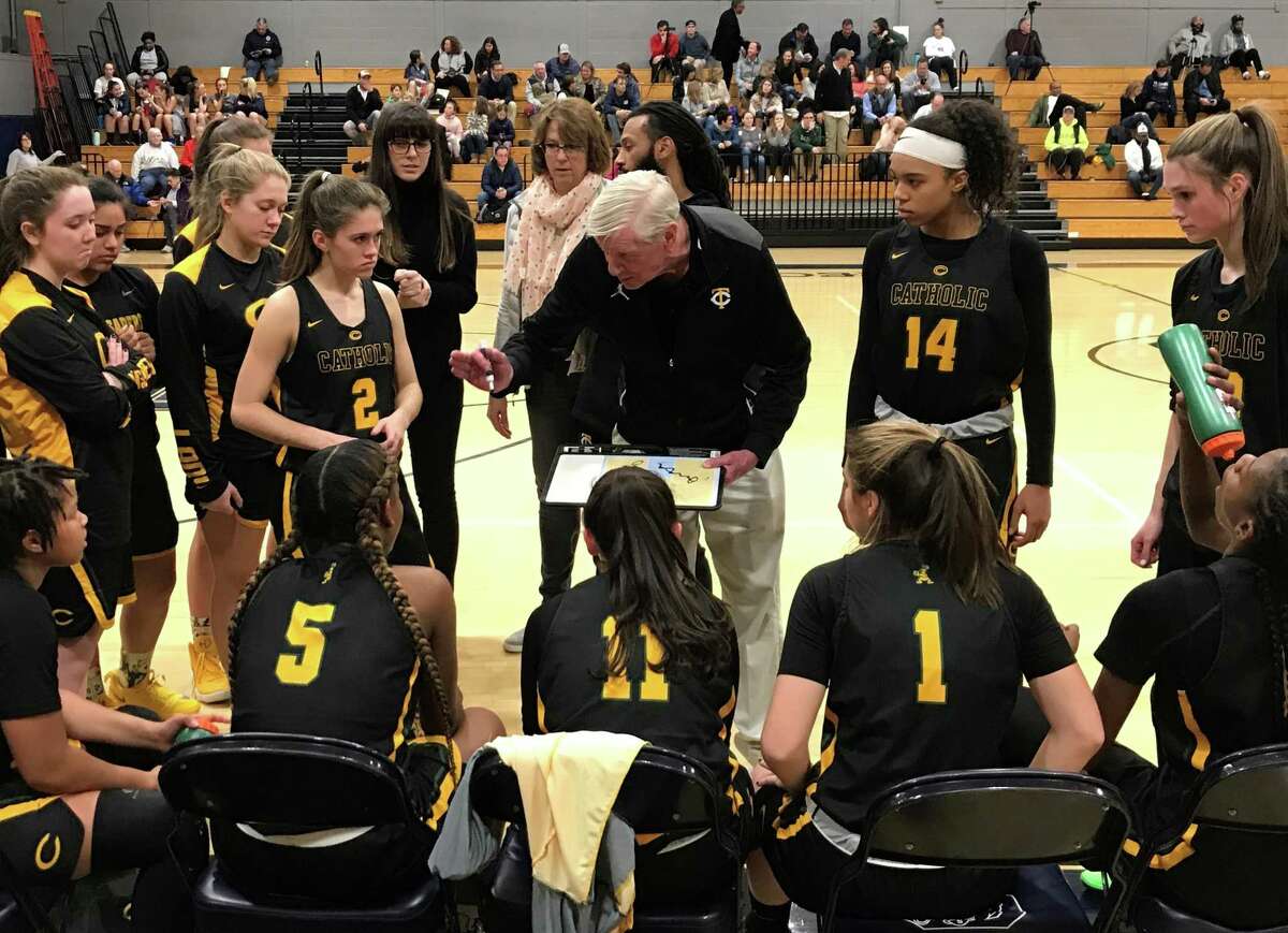 Trinity Catholic girls basketball coach Mike Walsh speaks to his team during a timeout against Staples on Thursday, Jan. 3, 2019 in Westport, Conn. Walsh, who won multiple FCIAC and state titles as the boys basketball coach at Trinity, picked up his first win as girls coach with a 68-49 win.