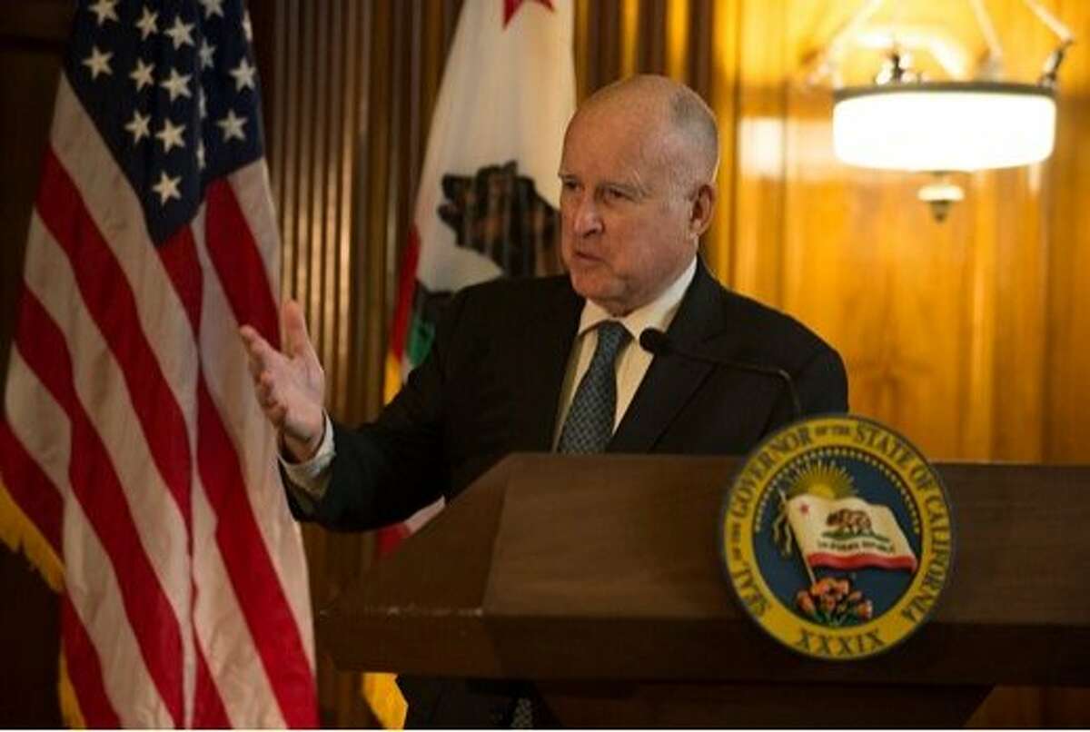 Gov. Jerry Brown swears in California Supreme Court Justice Joshua Groban on Jan. 3, 2019 in a Sacramento ceremony.