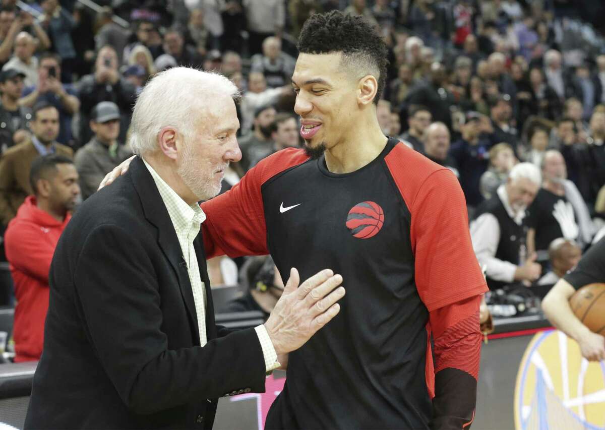 Danny Green gets a pat from his old coach Gregg Popovich as the Spurs host the Raptors at the AT&T Center on January 3, 2019.