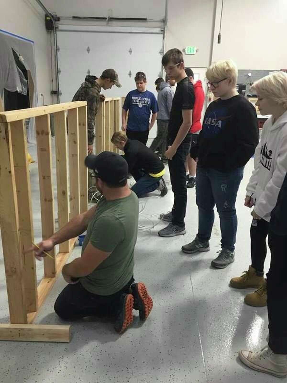 Students learn to wire a wall as part of the HBA Skilled Trades Exploring Club and Post. (Photo provided)