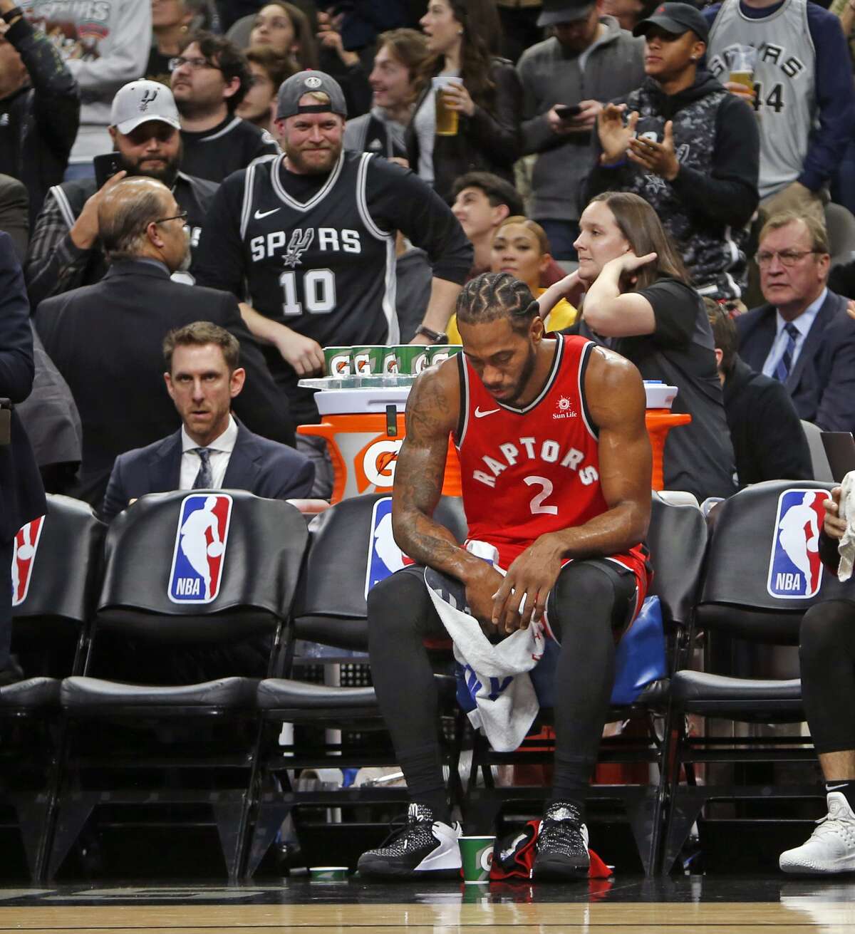 Kawhi Leonard #2 of the Toronto Raptors sits on the bench during a time-out against the San Antonio Spurs at AT&T Center on January 3, 2019 in San Antonio, Texas.
