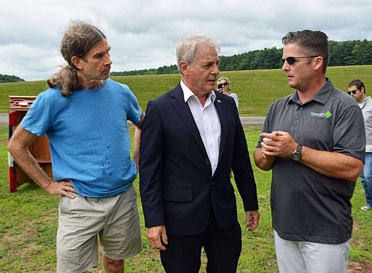 From left, Jeff Hush, member of the Middletown’s Clean Energy Task Force; former state senator Len Suzio, and James Desanatos, vice president of Business Development & Government Relations at Greenskies Renewable Energy; attended the unveiling of a solar array adjacent to the Higby Water Treatment Facility in June.