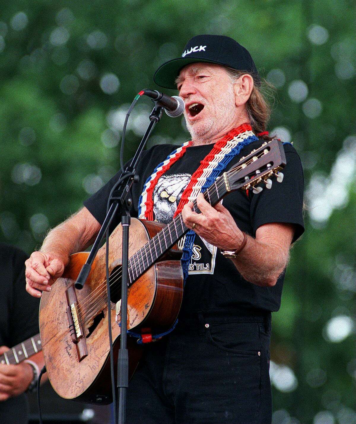 Willie Nelson playing at his s Fourth of July Picnic in 1998, was part of the outlaw country revolution that made the town famous in the mid-’70s.