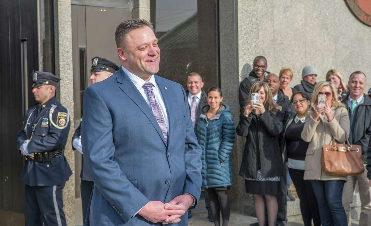Albany Police Detective James Olsen stands outside South Station for a tradition piping out ceremony to mark his retirement on Jan. 4, 2018, in Albany, N.Y.
