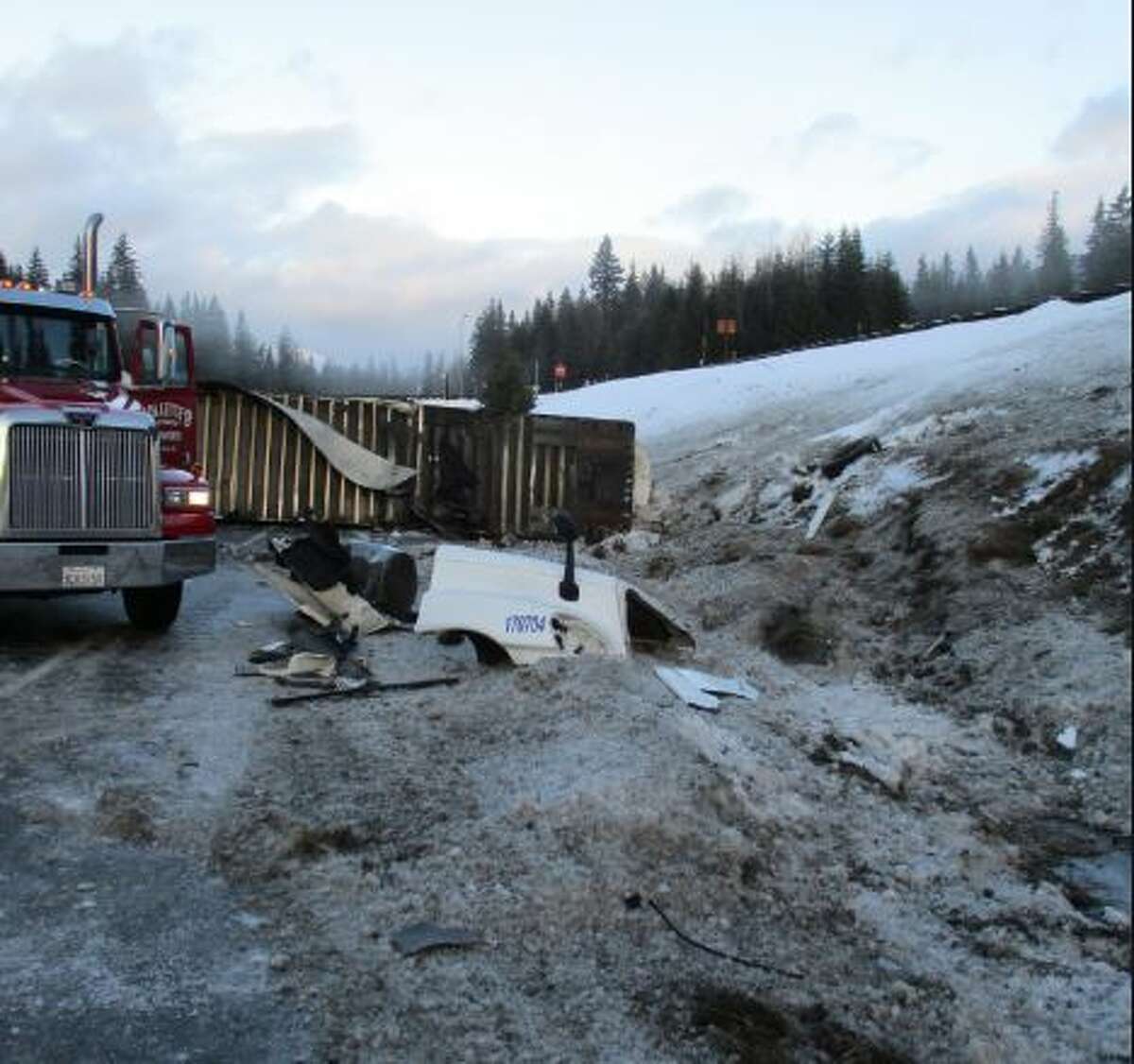 Photos of a crash scene on Interstate 90 about eight miles east of Snoqualmie Summit and nine miles west of Easton. At least one person died in the crash and an investigation was ongoing.