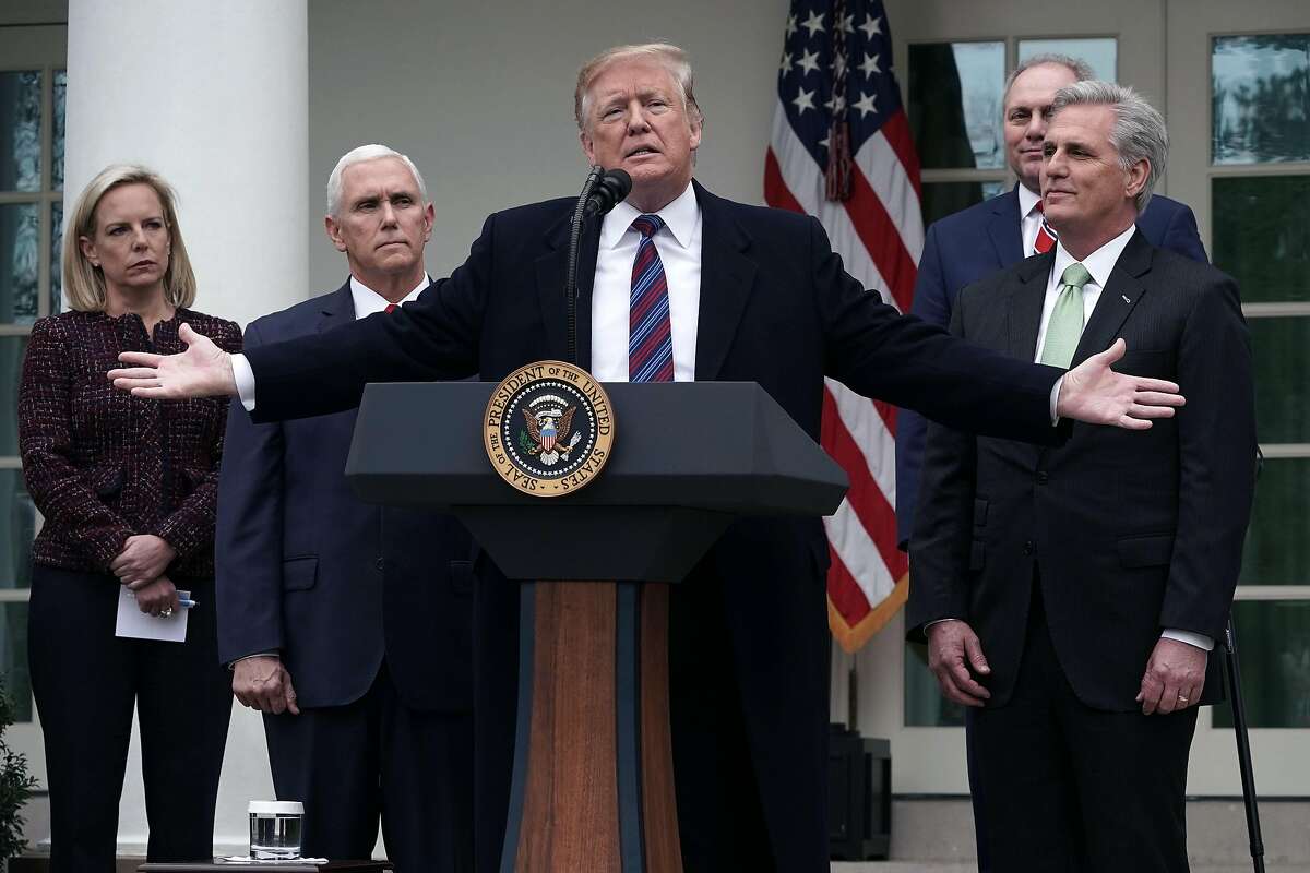 WASHINGTON, DC - JANUARY 04: U.S. President Donald Trump (3rd L) speaks as Secretary of Homeland Security Kirstjen Nielsen (L), Vice President Mike Pence (2nd L), House Minority Whip Rep. Steve Scalise (R-LA) (4th L) and House Minority Leader Rep. Kevin McCarthy (R-CA) (R) listen in the Rose Garden of the White House on January 4, 2019 in Washington, DC. Trump hosted both Democratic and Republican lawmakers at the White House for the second meeting in three days as the government shutdown heads into its third week. (Photo by Alex Wong/Getty Images)