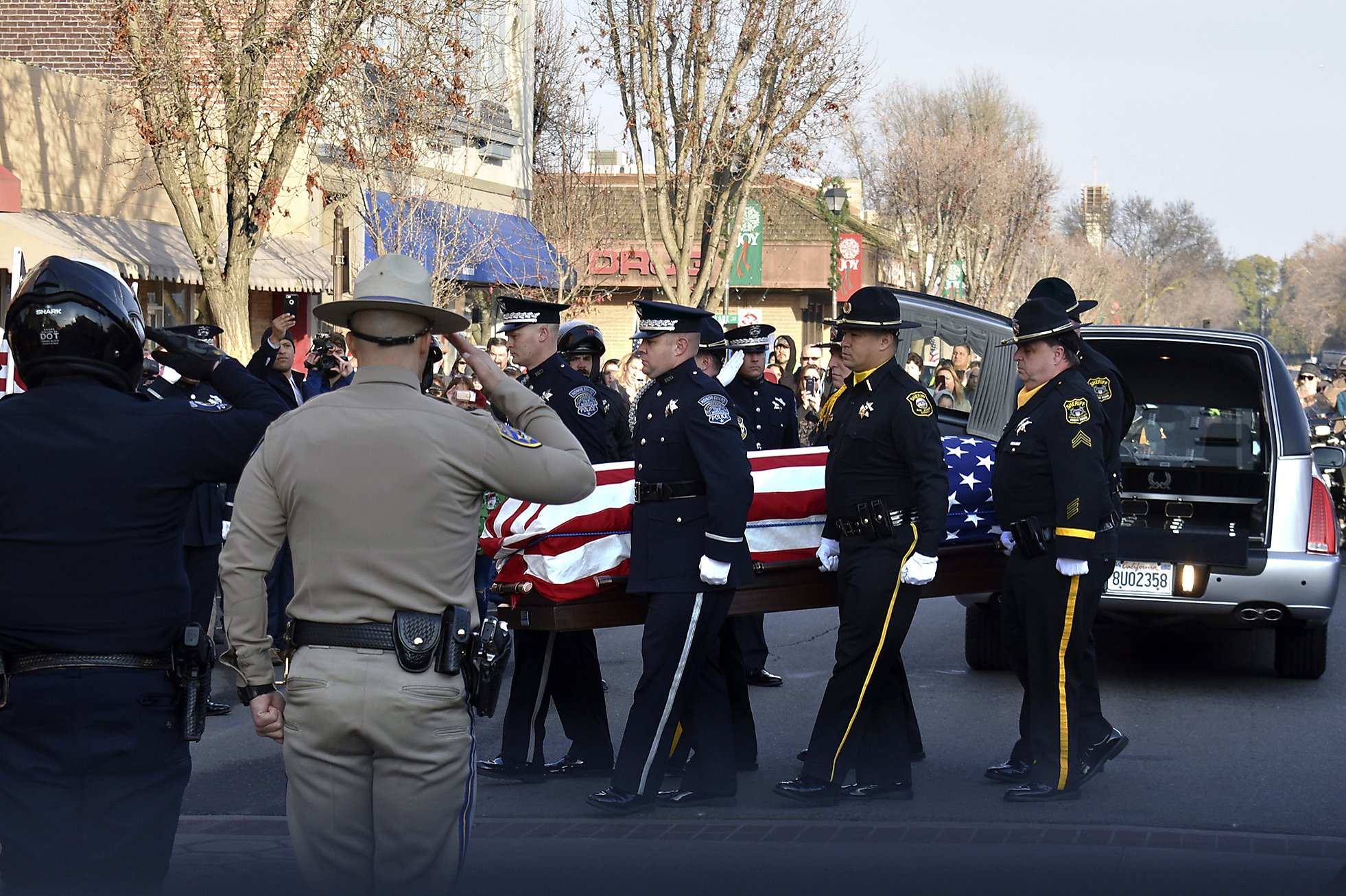 Slain California officer hailed as hero at funeral