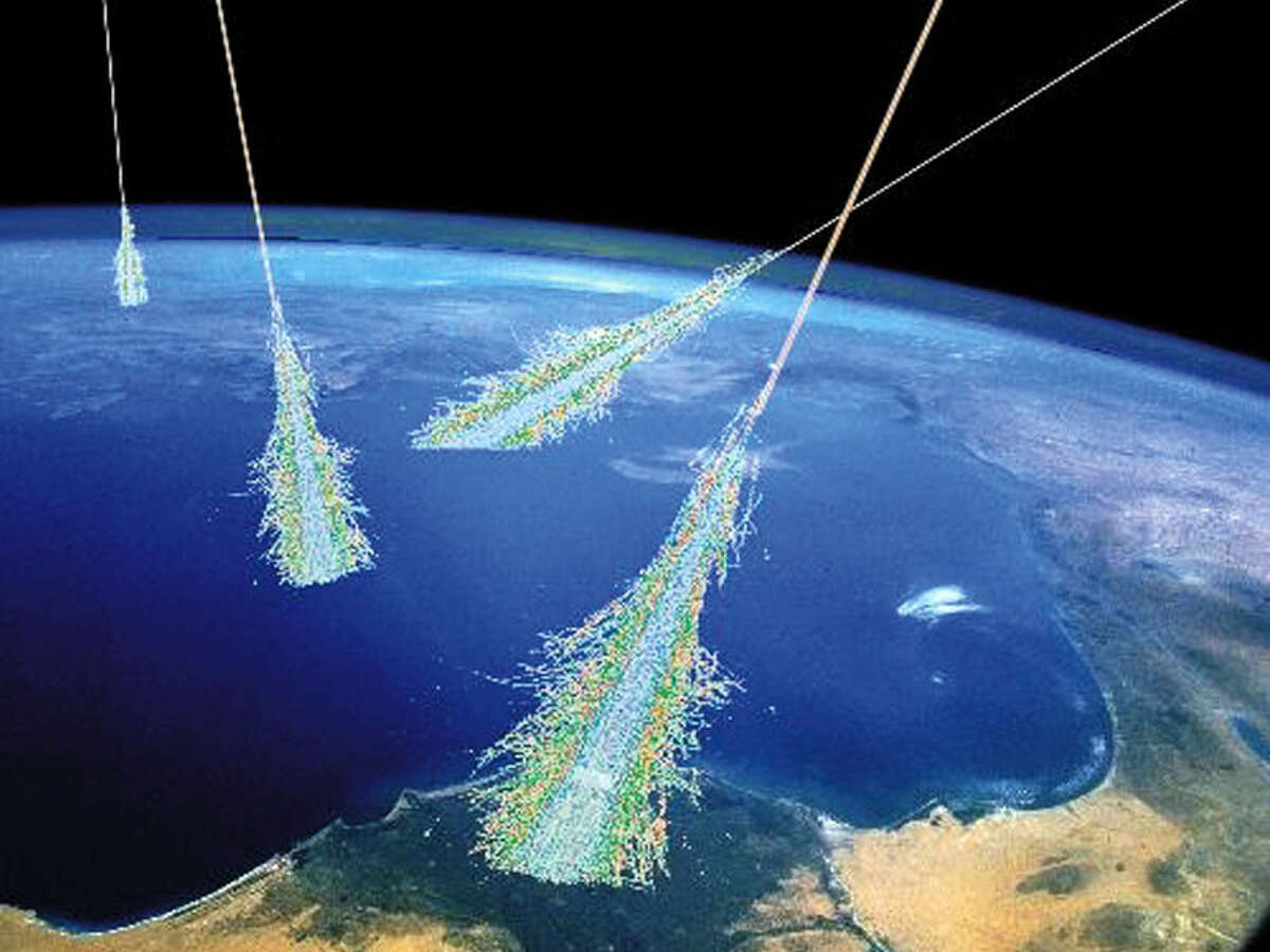 NASA: Have you ever been hit by a beam of high energy particles from above? Surely you have -- it happens all of the time. Showers of high energy particles occur when energetic cosmic rays strike the top of the Earth's atmosphere. Cosmic rays were discovered unexpectedly in 1912. It is now known that most cosmic rays are atomic nuclei. Most are hydrogen nuclei, some are helium nuclei, and the rest heavier elements. The relative abundance changes with cosmic ray energy -- the highest energy cosmic rays tend to be heavier nuclei. Although many of the low energy cosmic rays come from our Sun, the origins of the highest energy cosmic rays remains unknown and a topic of much research. This drawing illustrates air showers from very high energy cosmic rays. Cosmic rays may even be important to Earth's weather -- common lightning may be triggered by passing cosmic rays. Illustration Credit: Simon Swordy (U. Chicago), NASA
