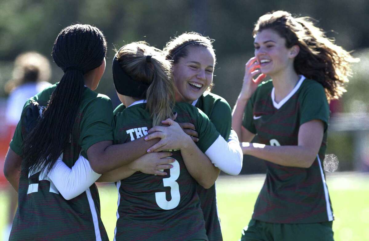 The Woodlands players react after a goal by Lauren Toma in the second period of a match during the Lady Highlander Invitational at Gosling Sports Complex, Friday, Jan. 4, 2019, in The Woodlands.