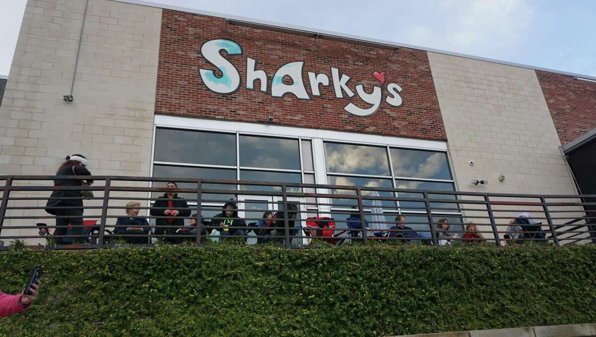 Attendees settle down besides casual-dining restaurant Sharky's to watch the fireworks in Kings Harbor on New Year's Eve. Sharky's won't have a reopening in the new year.