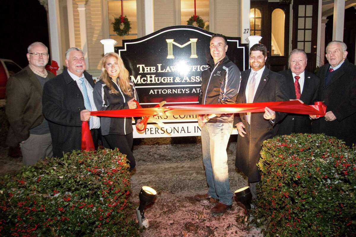 The Law Offices of McHugh & Associates held a grand opening Dec. 13. From left are Middlesex County Chamber of Commerce Central Business Bureau Chairman Thomas Byrne, Vice Chairman Don DeVivo, Partner/Attorneys Lori McHugh and Sean McHugh, Mayor Dan Drew, Chairman Jay Polke and Chamber President Larry McHugh.