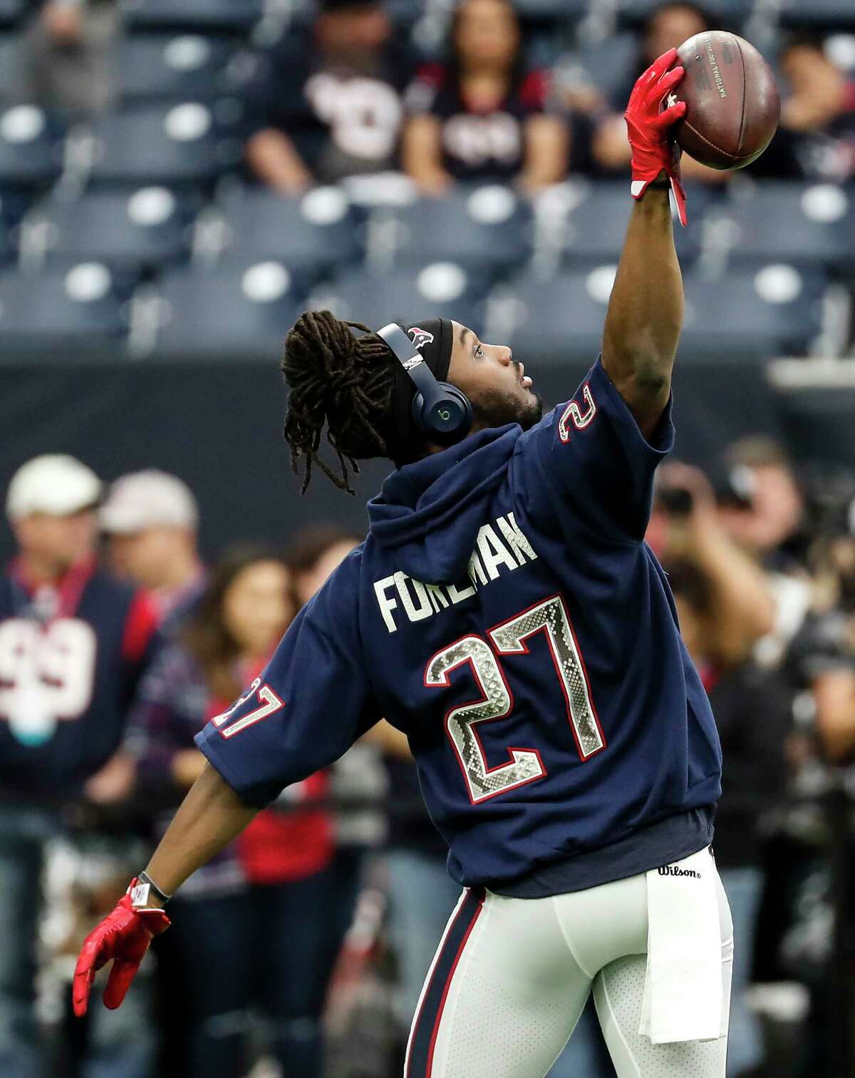 Houston Texans running back D'Onta Foreman (27) reaches out to catch a football before an NFL first round playoff game against the Indianapolis Colts at NRG Stadium on Saturday, Jan. 5, 2019, in Houston.