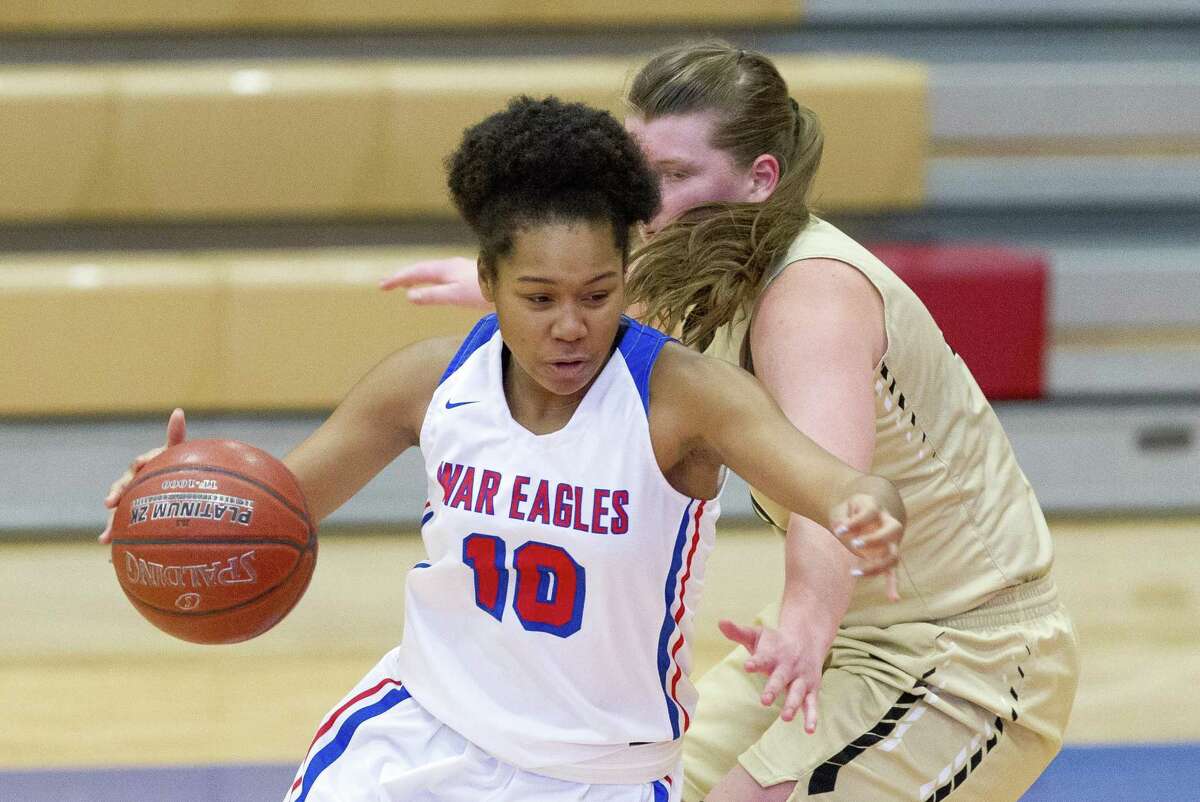 Oak Ridge forward Janiya Maxie (10) gets past Conroe center Lilly Rodel (34) during the third quarter of a District 15-6A high school basketball game at Oak Ridge High School, Saturday, Jan. 5, 2019, in Oak Ridge.