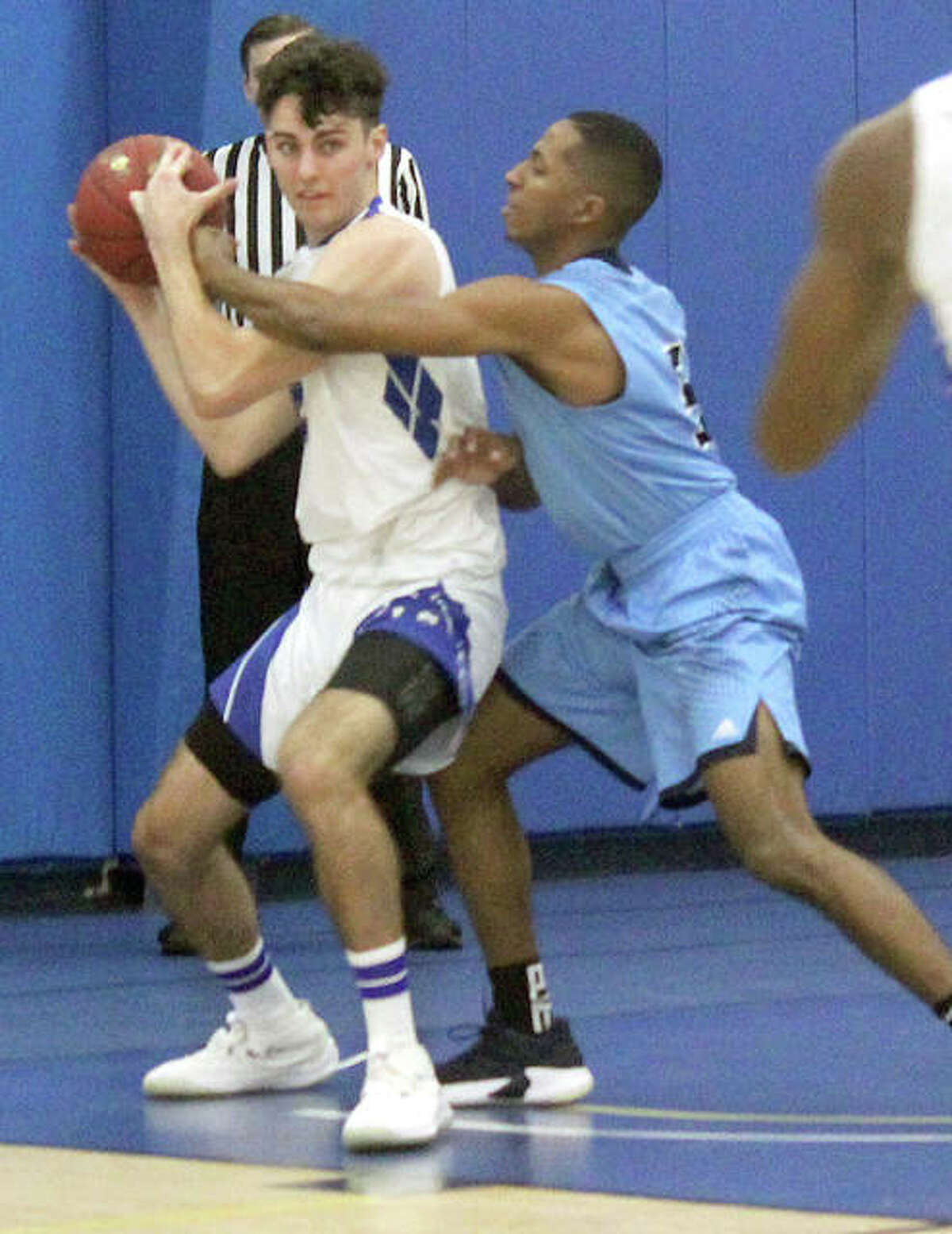 LCCC’s Ben Wright, left, is closely guarded by Darius Riley of St. Louis Community College during Saturday’s game at the River Bend Arena.