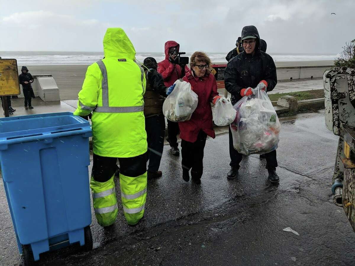 Reps. Jackie Speier, D-Hillsborough (middle to right) and Jared Huffman, D-San Rafael clean up trash at San Francisco beaches on Jan. 5, 2019.