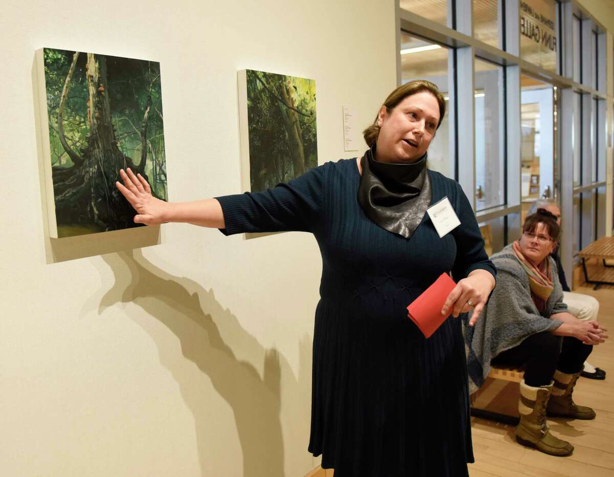 Artist Amy Talluto speaks about her work on display in the "Forces of Nature" exhibition at Greenwich Library's Flinn Gallery in Greenwich, Conn. Sunday, Jan. 6, 2019. The exhibition, which runs through January 23, shows how the beauty and wonder of nature provides endless visual influences and opens possibilities for art making. Work by artists Amy Talluto, Rebecca Hutchinson and Elena Lyakir is on display.