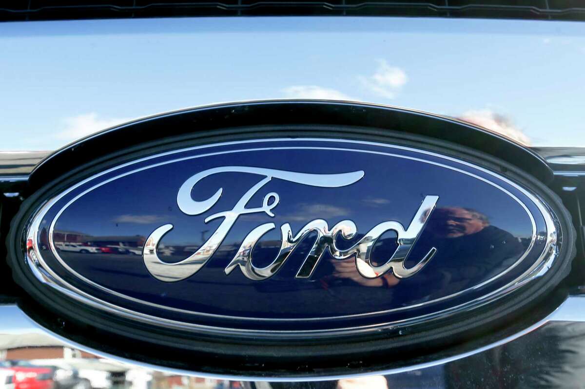 FILE - This Nov. 19, 2015 file photo shows the blue Ford oval badge in the grill of a pickup truck on the sales lot at Butler County Ford in Butler, Pa. On Friday, Jan. 4, 2019, Ford is recalling more than 953,000 vehicles worldwide to replace Takata passenger air bag inflators that can explode and hurl shrapnel. The move includes 782,000 vehicles in the U.S. and is part of the largest series of recalls in U.S. history.(AP Photo/Keith Srakocic, File)