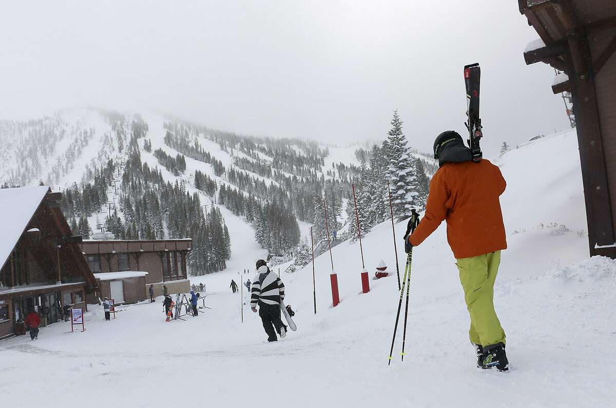 FILE - In this Nov. 29, 2018, file photo, skiers and snowboarders walk to the lifts at Mt. Rose Ski Tahoe near Reno, Nev. Avalanche warnings have been posted in parts of California, Nevada and Utah after a winter storm dumped heavy snow on the region. The Sierra Avalanche Center issued a backcountry avalanche warning for the Lake Tahoe area stretching south into the Sierra along the California-Nevada line from noon Sunday, Jan. 6, 2018, until 7 a.m. (Jason Bean/The Reno Gazette-Journal via AP, File)